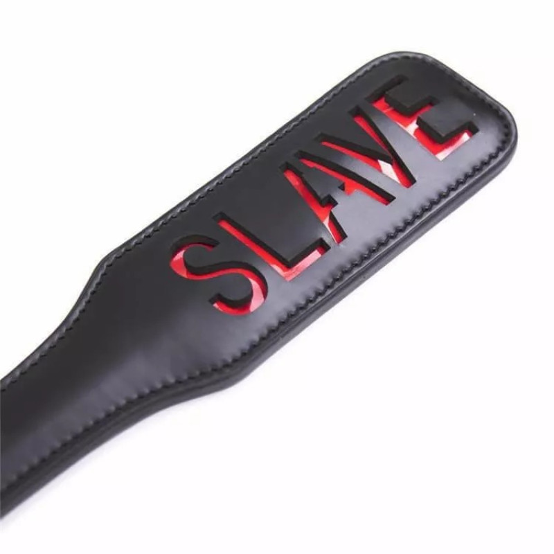 Шльопалка овальна з вирізом SLAVE PADDLE, чорна, 31,5 см Шльопалка овальна з вирізом SLAVE PADDLE, чорна, 31,5 см